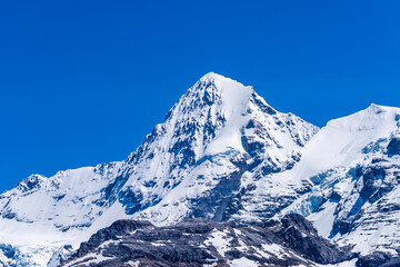 Fototapeta na wymiar The Swiss Alps at Murren, Switzerland. Jungfrau Region. Snow peaks.