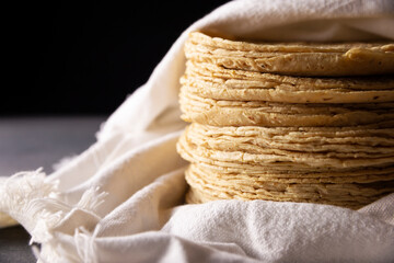 Corn Tortillas. Food made with nixtamalized corn, a staple food in several American countries, an...