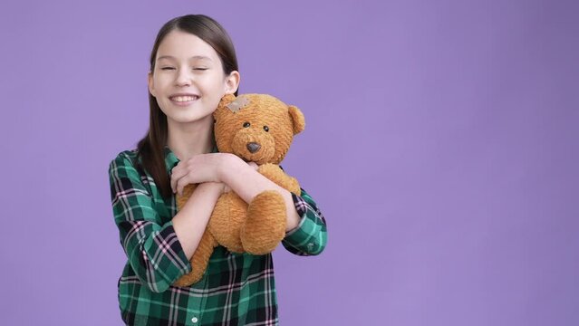 Positive child play stuffed animal isolated vibrant color background