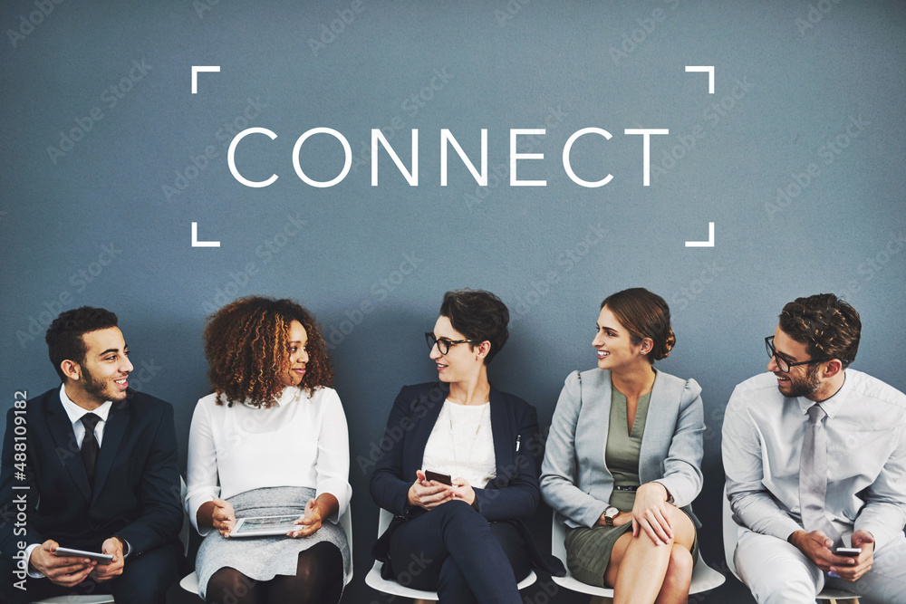 Aufkleber Networking before their interview. Studio shot of businesspeople talking while waiting in line with the word network above them against a gray background.