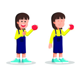 Happy little girl eats her apple