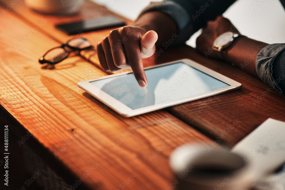 Aufkleber technology lets me work on any device. cropped shot of an unrecognizable businessman sitting alone i