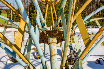 Metal structures close-up, old children's rides in an abandoned camp