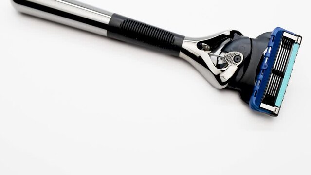 Modern men's razor with a lot of blades on a white background. Gift for the modern man. Body and beard care. Blitz machine.