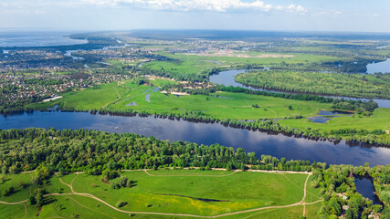 Fototapeta na wymiar Aerial drone view of Dnieper and Dniester river near Kyiv, green islands from above, nature river landscape in spring, Ukraine 