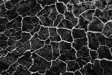 abstract black background with white cracks overlay ground cracked drought, old paint