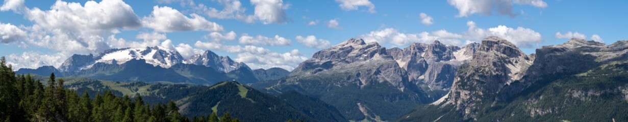 Fototapeta na wymiar Amazing aerial landscape at the Dolomites. View on Sella group and Marmolada. Alta Badia, Sud Tirol, Italy