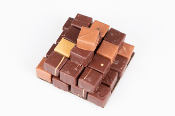 brown square pyramid chocolate pralines in top view in white background