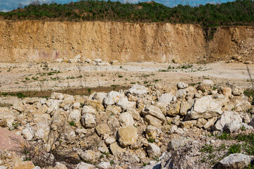 Blocks of white limestone rock in a stone quarry