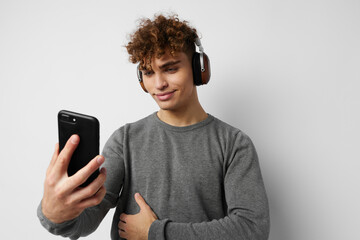 handsome guy headphone music technology with phone isolated background