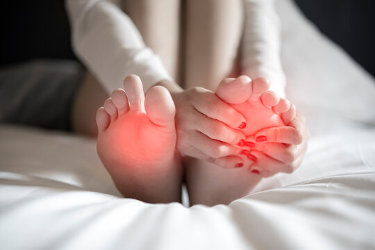 Pain In The Foot, Girl Holds Her Hands To Her Feet, Foot Massage