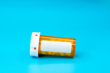  Medical vial with pills and empty label without text. Medical pills in orange Plastic...
