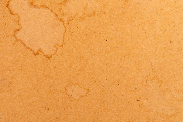 Grunge dirty stained paper. Brown background. Aging material