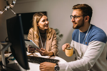 Business people having fun and chatting at workplace office