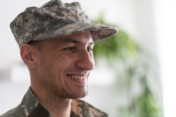 Fototapeta premium Photo of soldier in camouflaged uniform close-up view.