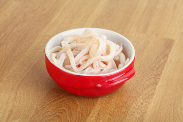Marinated squid strips in the bowl
