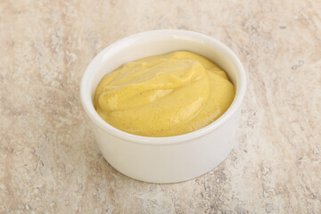 Organic mustard sauce in the bowl