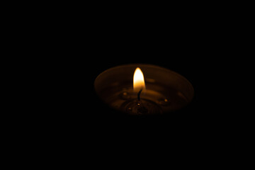 Candle flame at night in total darkness