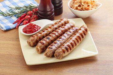 Grilled sausages with cabbage and sauce