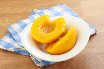 Sweet canned peaches with syrope