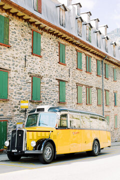 Yellow postbus - schoolbus at Furkapass in Switserland