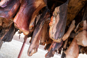 Fototapeta na wymiar Hákarl - in einer Trockenhütte des Bjarnahöfn Shark Museum hängt das fermentierte Fleisch des Grönlandheis zum Abgasen und trocknen.