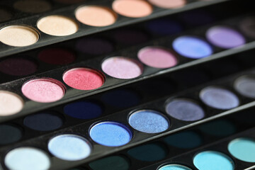 Obraz na płótnie Canvas Bright palette of trendy eyeshadow on black stand
