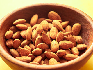 Almonds on a wooden surface.