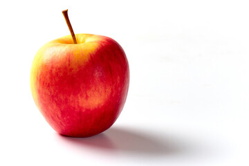 Red-yellow apple close-up. Bright apple on a white background.