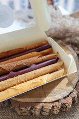 Natural fruit marshmallow in a white box on a wooden background