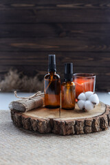 Set of natural oils for face and body care on a wooden background. SPA concept