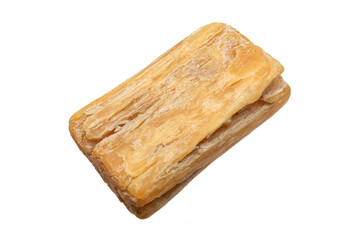 Isolated old cracked laundry bar soap on a white background