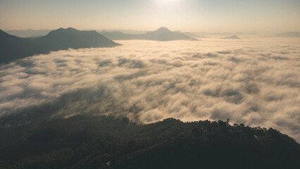 Sea of Fog covers the area on the top of hill Doi Phu Thok, Chiang Khan, Loei, Thailand with background of sunrise on winter. 