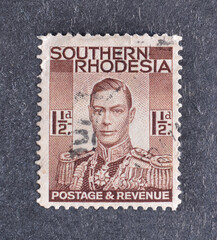 Postage stamp printed by Southern Rhodesia, that shows portrait of king George VI, circa 1937.