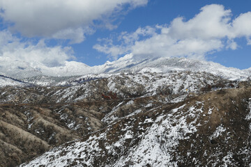 Fototapeta premium The snow-covered San Jacinto Mountains on a winter day, as seen from the Pines to Palms Highway, Southern California, USA. 