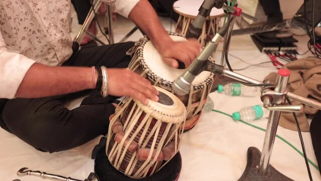 Shot of a man playing tabla at Indian Wedding Function at New Delhi, India
