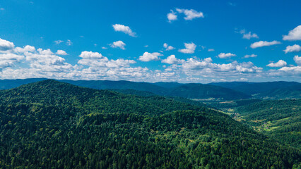 mountains aerial view in blue sky clouds
