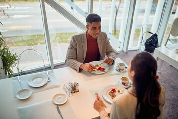 colleagues having lunch at office cafeteria