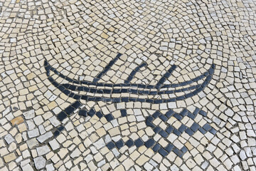 black and white basalt pavement representing a boat on a sidewalk in Aveiro, Portugal