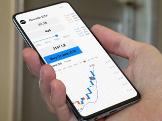 Stock world exchange market chart, etf data on smartphone. Business analysis of a trend exchange-traded fund. Invest in international growth ETF