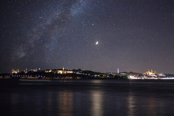 Istanbul and Milky Way. Cityscape of Istanbul at night. Photo manipulation. Noise included.