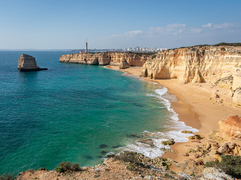 Rocky cliffs and golden sand beaches in southern Portugal 1