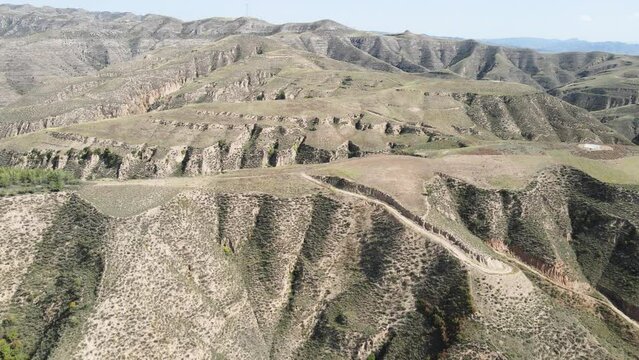 Aerial photography of earth hills and mountains on the Loess Plateau in Northern Shaanxi, China