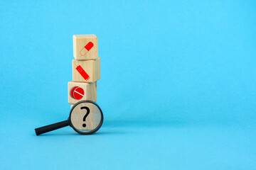 wood cubes with magnifying glass,loupe, healthcare medical icon.