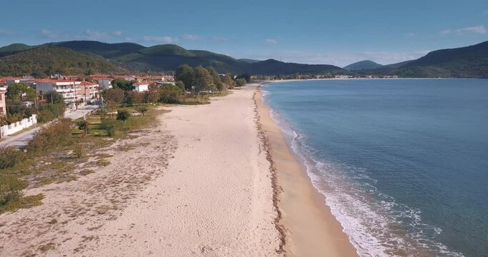 Idyllic aerial video of the sandy Toroni beach on the Sithonia peninsula in the Halkidiki region of Greece. Recreation and tourism concept