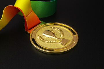 Gold medal with ribbon on black background	