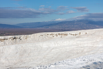 Carbonate travertines the natural pools during sunset, Pamukkale, Turkey