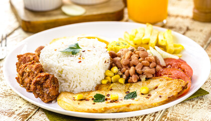 plate of rice and beans typical of brazil, healthy and light food, fried egg and salad, brazilian executive lunch