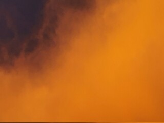 Beautiful cloudy sky, in shades of orange.