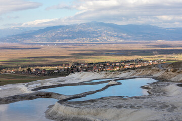 Carbonate travertines the natural pools during sunset, Pamukkale, Turkey